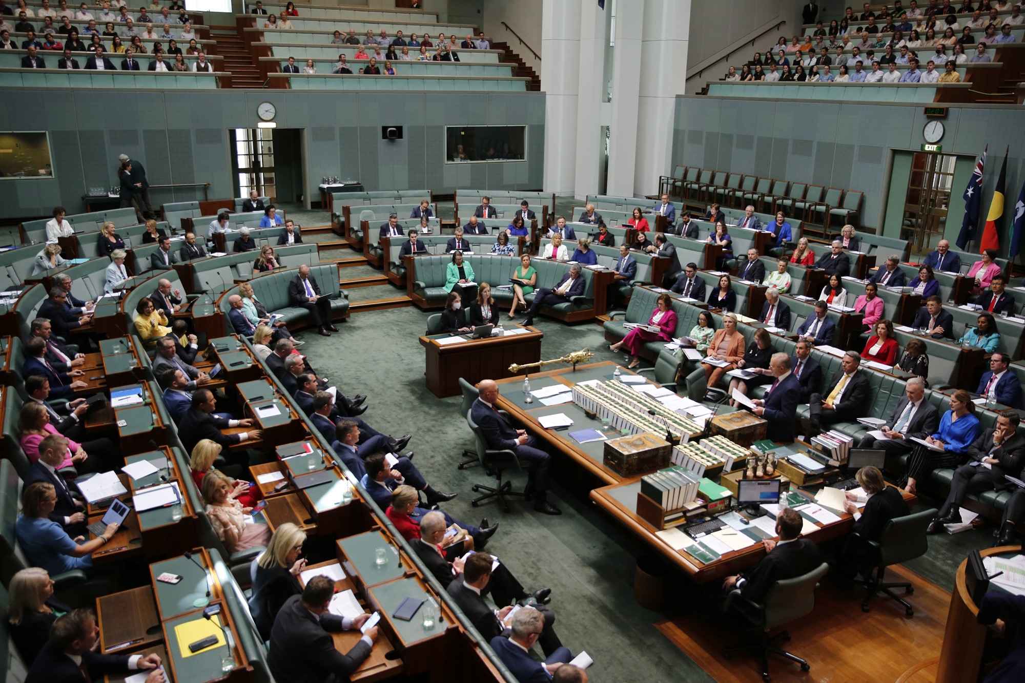 A wide shot of a crowded parliament house of representatives